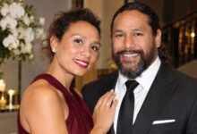 Theodora Holmes and Troy Polamalu posing together at a formal event