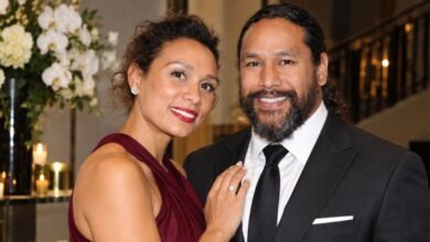 Theodora Holmes and Troy Polamalu posing together at a formal event