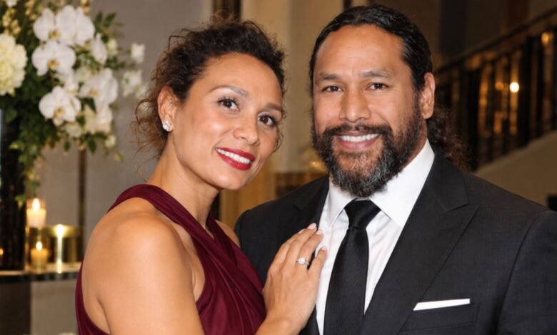 Theodora Holmes and Troy Polamalu posing together at a formal event